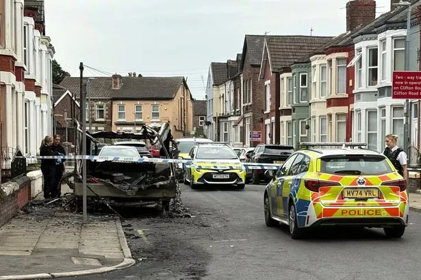 Police on Clifton Road East in Tuebrook after a caravan went up in flames 