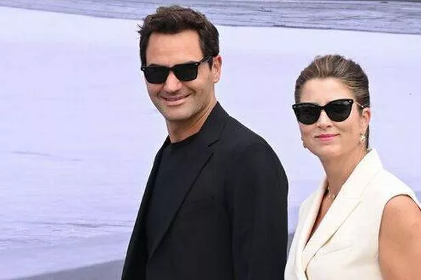Roger and Mirka Federer walk together