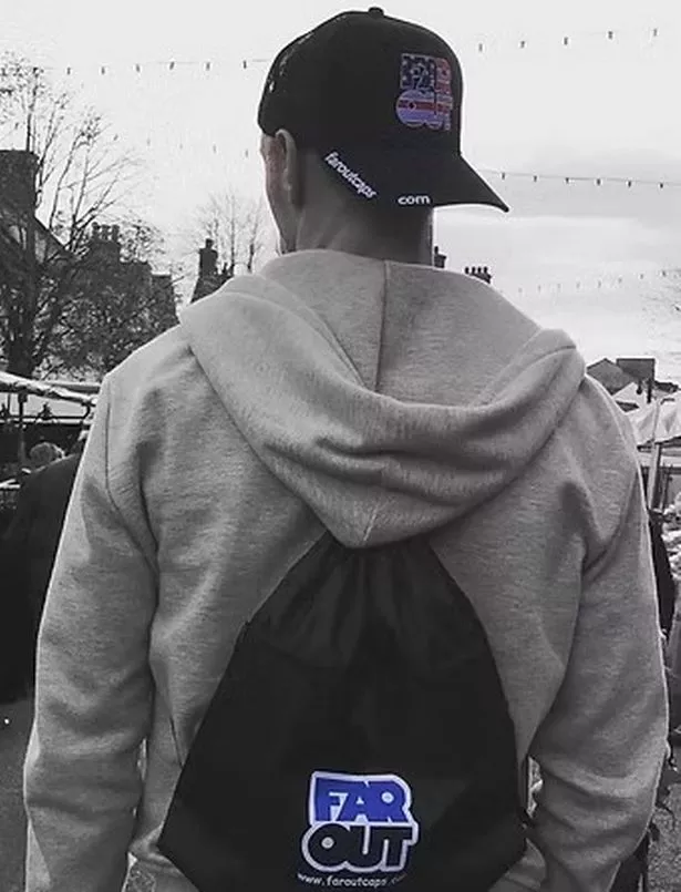 Doyle wearing one of the caps he designed. 