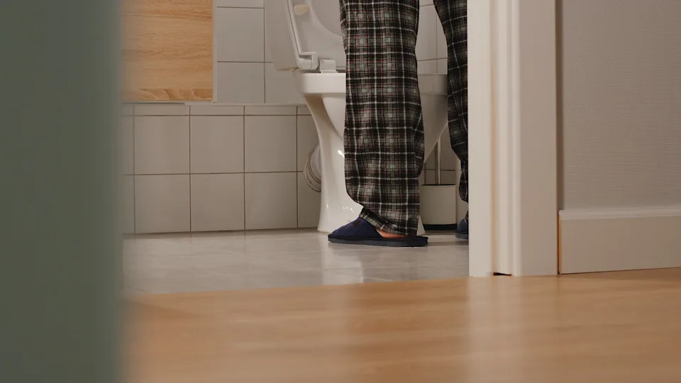Adult man in a toilet at home