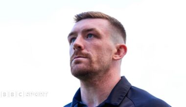 Ed Chamberlain, looking upwards, wearing training gear ahead of