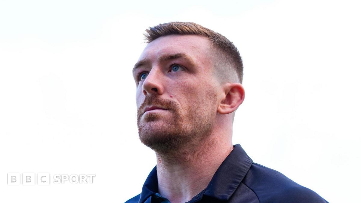 Ed Chamberlain, looking upwards, wearing training gear ahead of