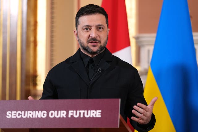 Volodymyr Zelensky at lectern with the words Securing Our Future
