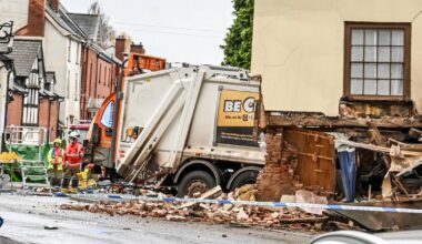 West Midlands: Man dies after bin lorry collides with building