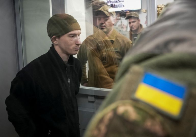 Russian soldier Dmytro Kurashov, accused of committing a war crime by executing a Ukrainian serviceman who had surrendered during combat, attends a court hearing expected to deliver a verdict, amid Russia's invasion of Ukraine, in Zaporizhzhia, Ukraine November 6, 2025. REUTERS/Inna Varenytsia