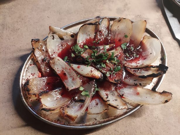 A salad of grilled onion, pomegranate, sumac and mixed herbs was enchantingly original