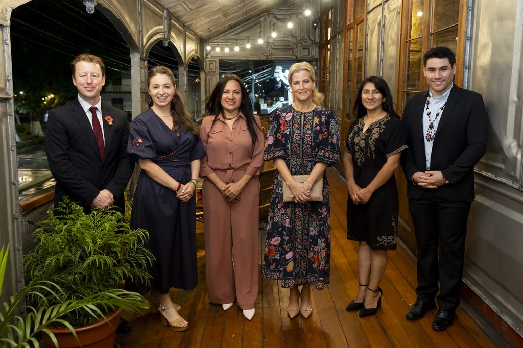 Gavin Cook, the British Ambassador to Peru (first left), the Duchess of Edinburgh (third right) and members of a BLF programme stand in line on terrace of restaurant