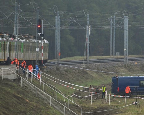 Special forces and police investigate at the scene of a destroyed section of railway tracks on the Deblin-Warsaw route near the Mika railway station, central Poland.