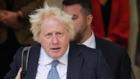 PA Media Former prime minister Boris Johnson leaves Dorland House in London after giving evidence for module 8 (children and young people) in the UK Covid-19 Inquiry