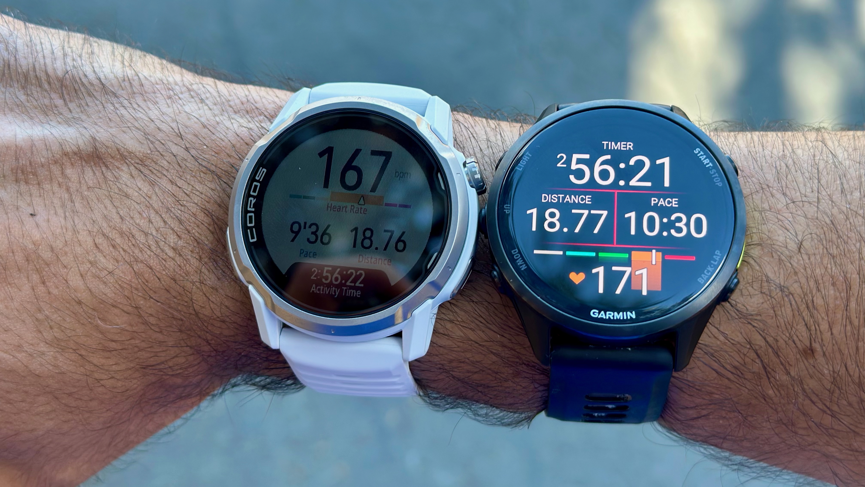 A photo of the COROS APEX 4 and Garmin Forerunner 970 on the same wrist, for comparing GPS and HR data in the same workout. COROS's distance data is 0.01mi lower, while its current HR is 3 bpm lower.