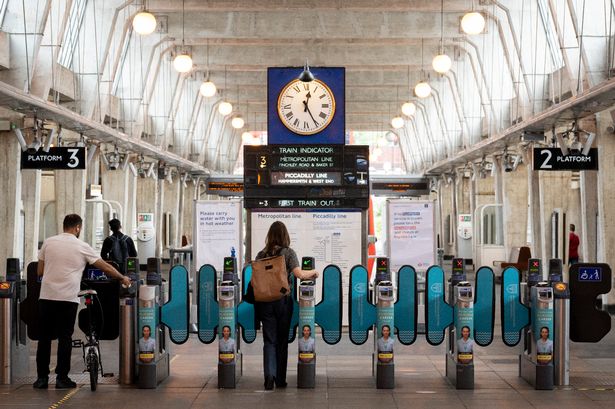 tube travellers pass through the barriers at Uxbridge tube station