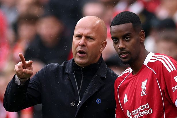 Arne Slot speaks to Alexander Isak before coming on for Liverpool in the Merseyside derby win over Everton at Anfield earlier this season