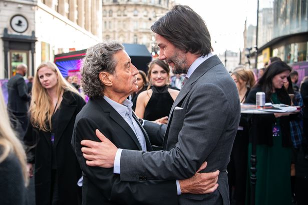 Ian Mcshane and Keanu Reeves attend the world premiere of "Ballerina" in 2025