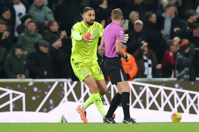 Gianluigi Donnarumma of Manchester City protests to referee Sam Barrott after Harvey Barnes of Newcastle United scores their side's second goal during the Premier League match between Newcastle United and Manchester City at St James' Park