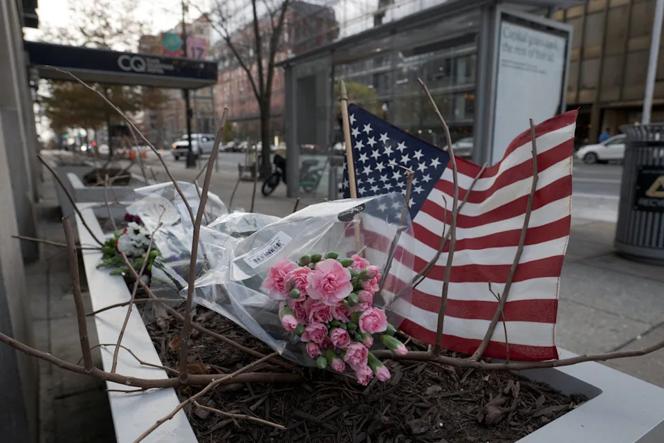 A makeshift memorial is seen outside of the Farragut West Metro Station a day after two National Guard members were shot in Washington, D.C.