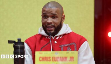 Chris Eubank Jr wearing a red jacket with white sleeves