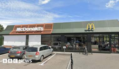Family having a moment together messing about while winter sea swimming