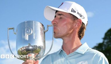 David Puig kissing the Australian PGA Championship trophy