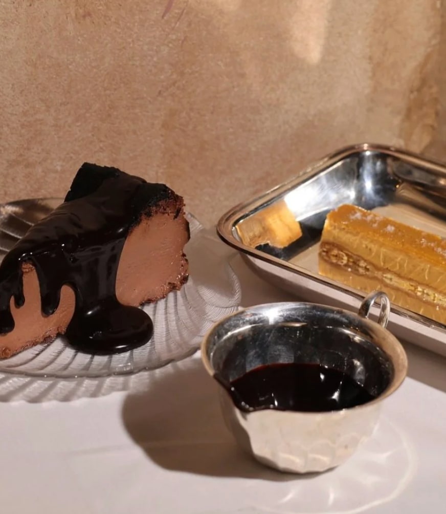 chocolate cake with sauce in metal dish