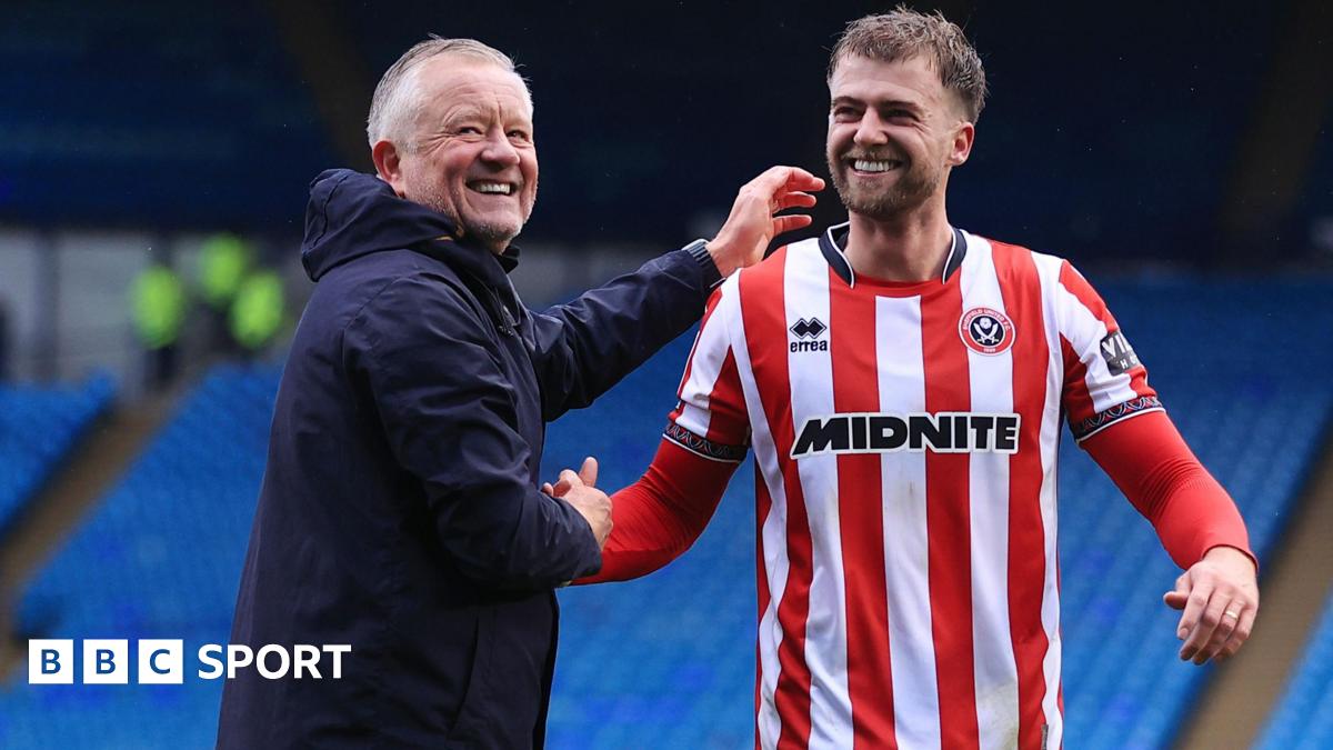 Sheffield United boss Chris Wilder (left) celebrates after the game with new signing Patrick Bamford