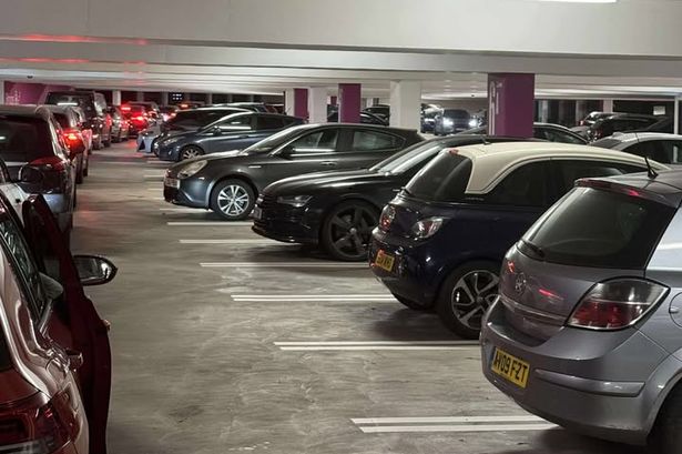 A long line of cars waiting to get out of Cabot Circus car park