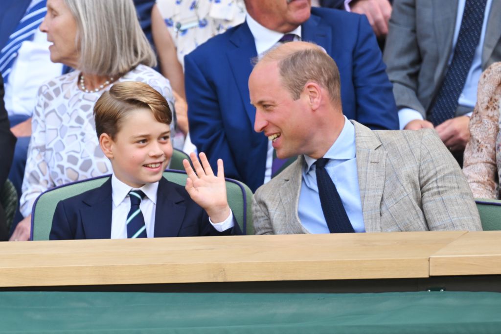 Prince George waving and Prince William laughing at him