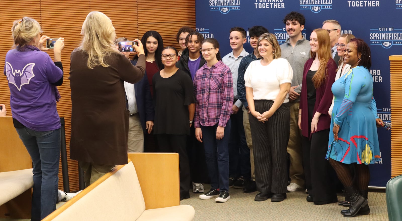 Members of student advocacy group Bringing Awareness to Students (BATS) pose for a photo at the Springfield City Commission meeting Tuesday, Nov. 18, 2025. JESSICA OROZCO/STAFF