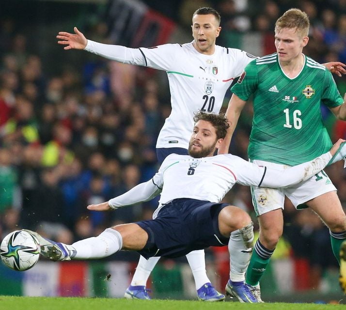 Alastair McCann and Italy’s Manuel Locatelli during the World Cup qualifier at Windsor Park in 2021, which ended 0-0. Italy won the return fixture 2-0