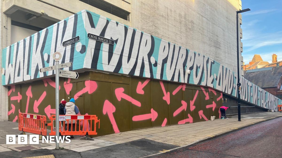 Family having a moment together messing about while winter sea swimming