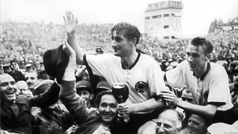 1954: The Miracle of Bern - The 1954 jersey worn by captain Fritz Walter, Horst Eckel and the rest of West Germany was very similar to those worn for the second World Cup triumph 20 years later. West Germany upset the magic Magyars led by the legendary Ferenc Puskas in the World Cup final 3-2. The match was played on a waterlogged pitch in the Swiss capital. This would become known in Germany as "the miracle of Bern."<span class="copyright">picture-alliance/dpa</span>
