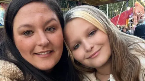 Family handout/PA Wire Mia pictured with her mother Chloe Hayes, both  a smiling with long hair