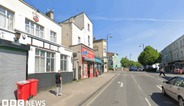 Family having a moment together messing about while winter sea swimming