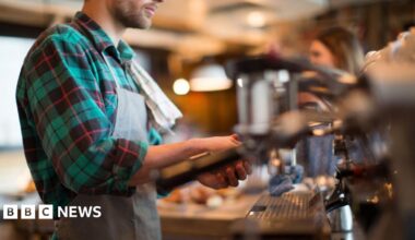 man working in a coffee shop