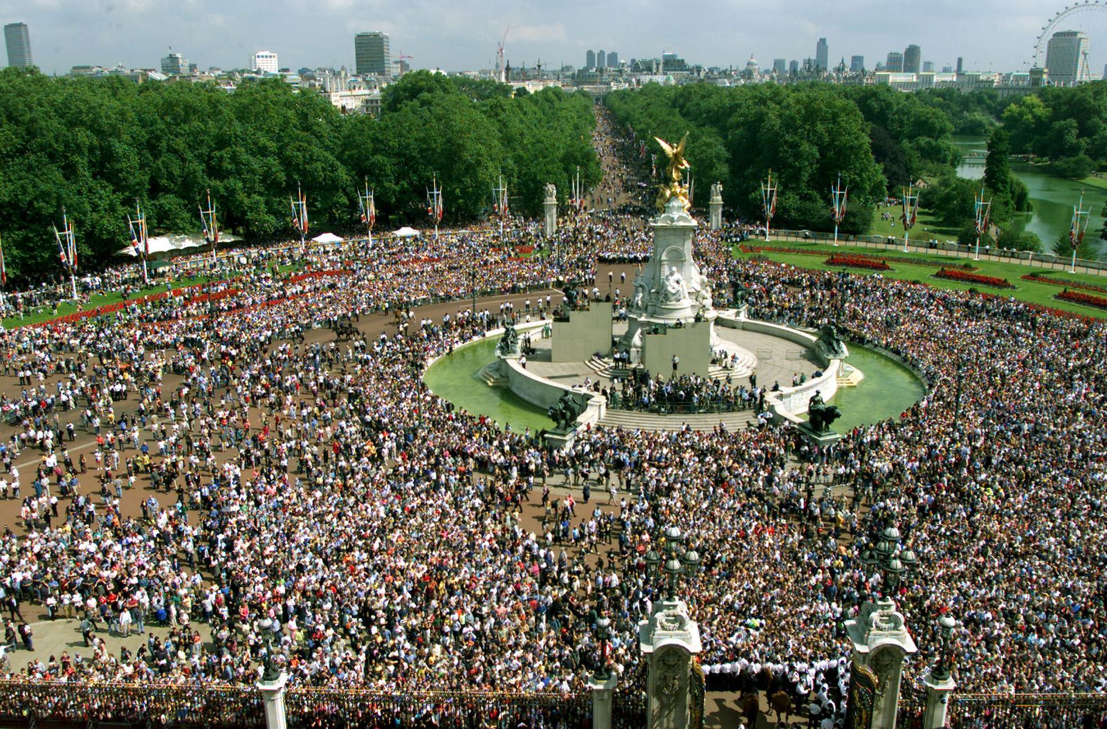 From the balcony the Royal Family look across the Queen Victoria Monument and down The Mall as seen on the occasion of...
