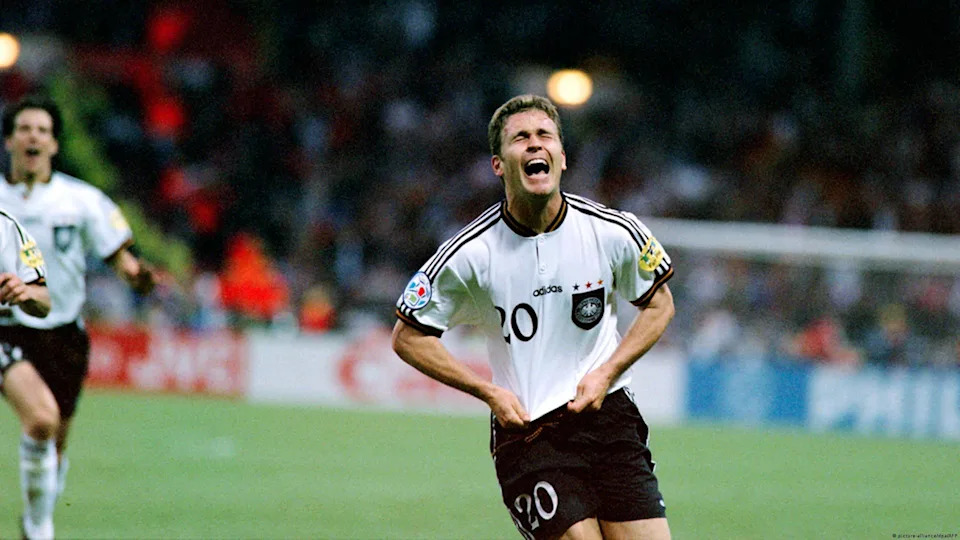Euro 96 champions! - Oliver Bierhoff's golden goal against the Czech Republic sealed the Euro 96 title for Germany at Wembley. The jersey Germany wore when "football came home" to England differed from its predecessors because it featured a white eagle on a black crest.<span class="copyright">picture-alliance/dpa/AFP</span>