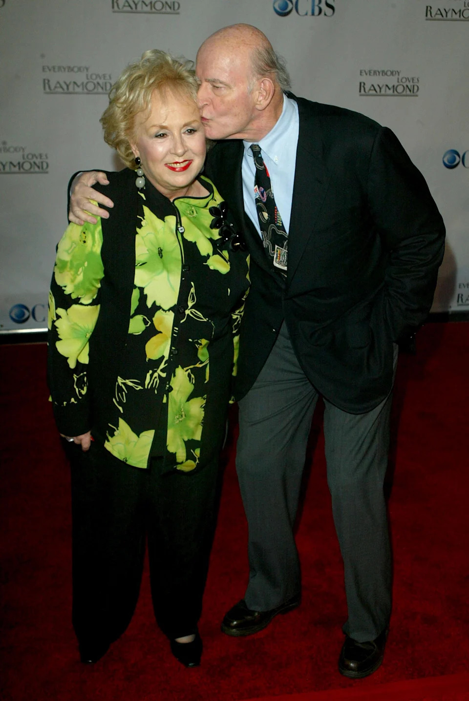 Peter Boyle plants a smooch on onscreen wife Doris Roberts at the wrap party for "Everybody Loves Raymond" on April 28, 2005.