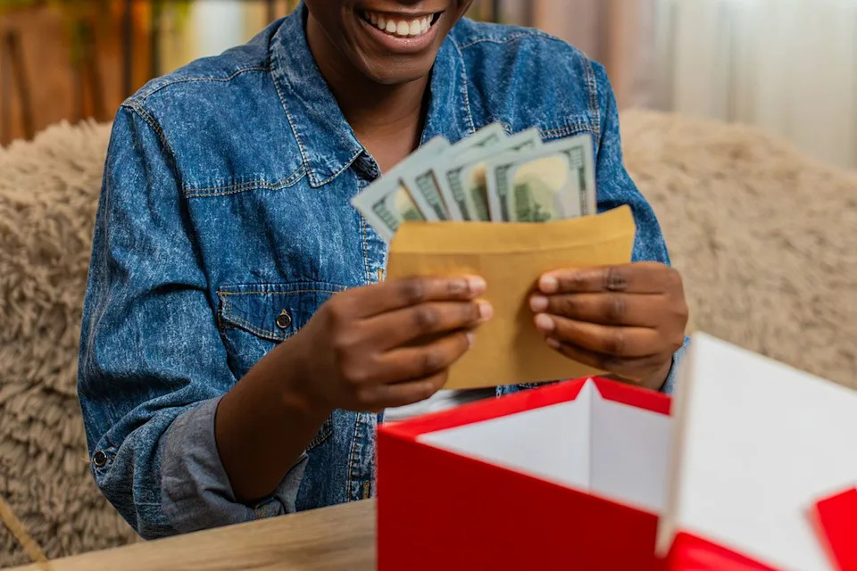 Getty Stock photo of a woman receiving money