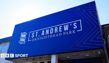 General shot of the main stand at St Andrew's showing Birmingham City Football Club across the front of the roof.