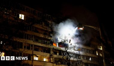 A firefighter works at the site of an apartment building hit by a Russian drone strike in Kyiv, Ukraine on 25 November 2025.