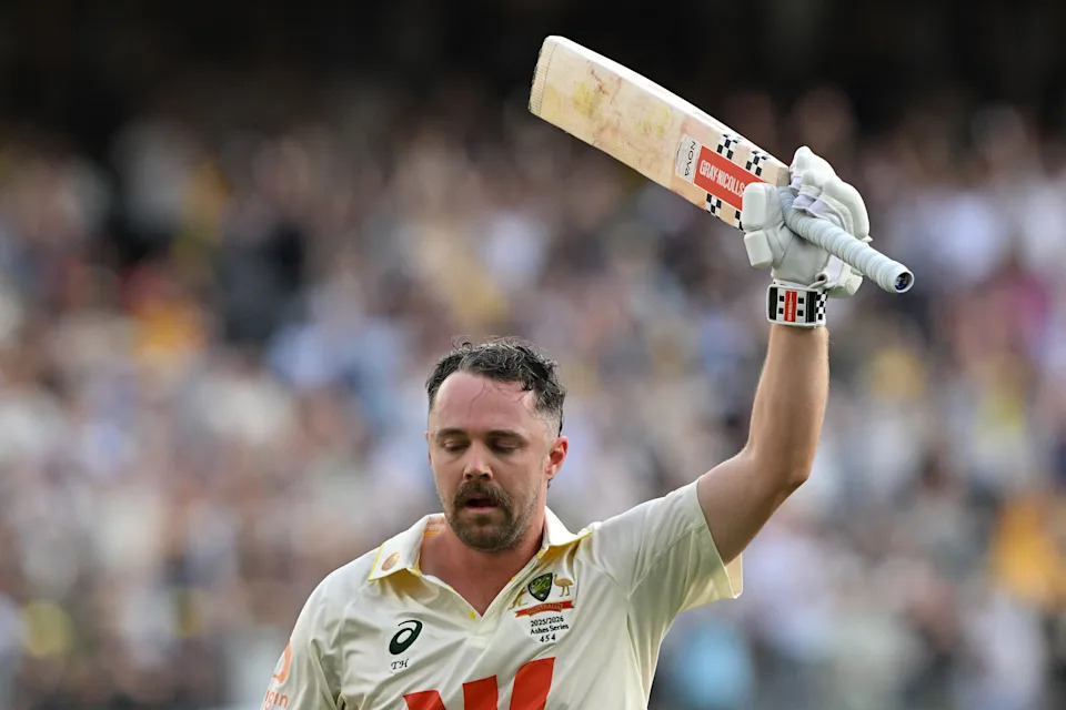 Travis Head scores a century.