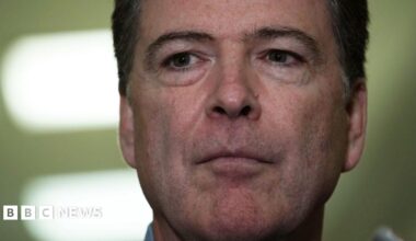 Comey is questioned by reporters outside of a congressional committee hearing in 2018