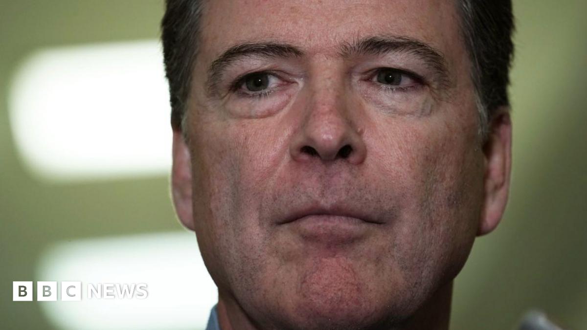 Comey is questioned by reporters outside of a congressional committee hearing in 2018