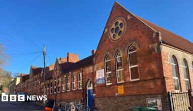 Hotwells Primary School in Hotwells, Bristol. It is a red brick building with lots of windows on it.