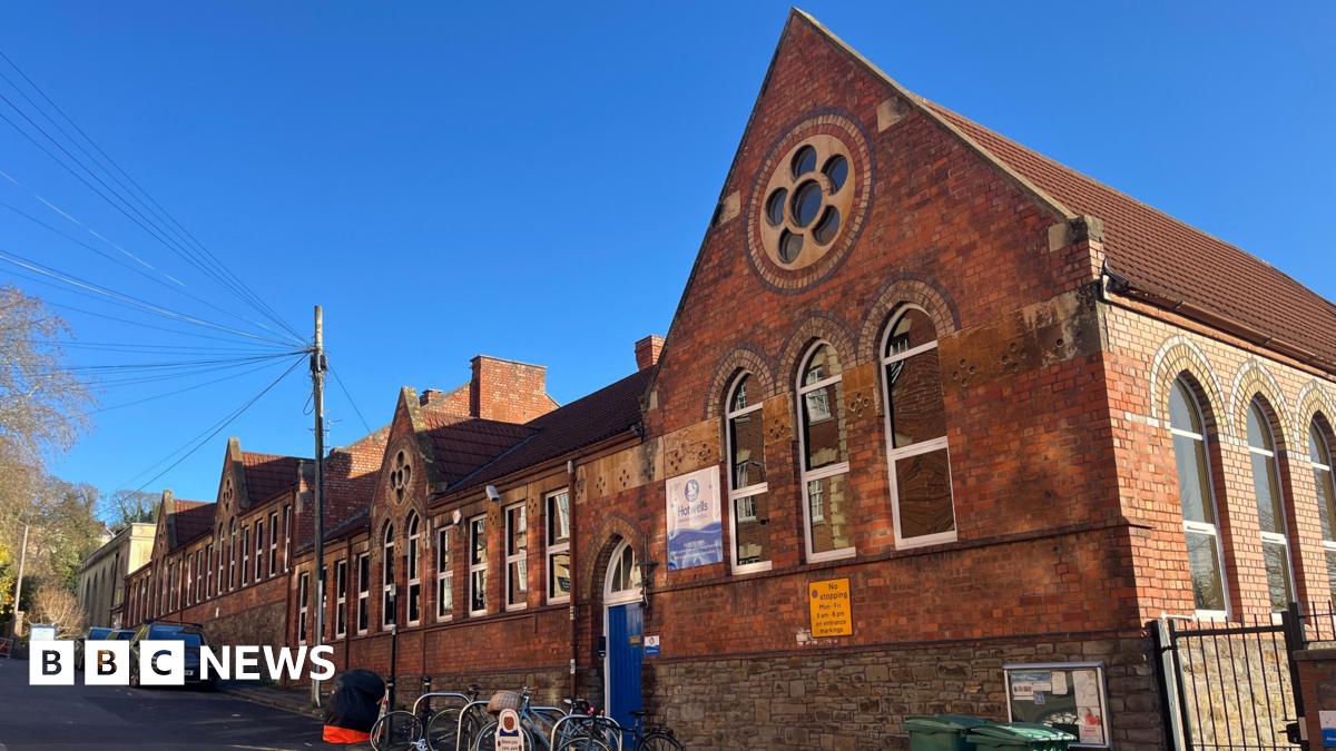 Hotwells Primary School in Hotwells, Bristol. It is a red brick building with lots of windows on it.