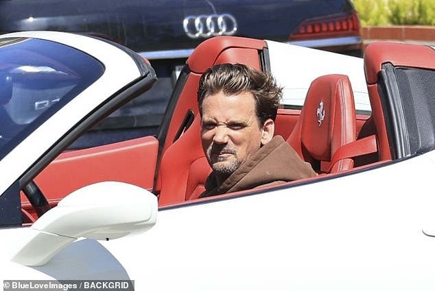He was spotted shopping in Beverly Hills before zipping off in a white Ferrari with the top down