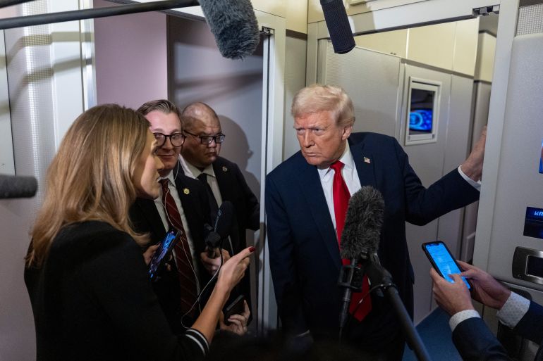 Trump speaks to reporters on Air Force One
