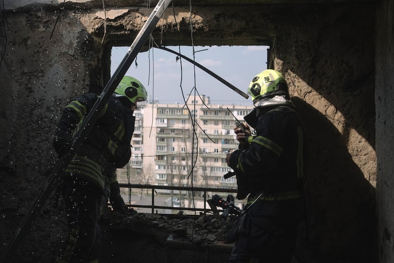 Firefighters inspect the damage to a residential building following a Russian night drone strike in Kyiv, Ukraine. Photograph: Andrew Kravchenko/Bloomberg