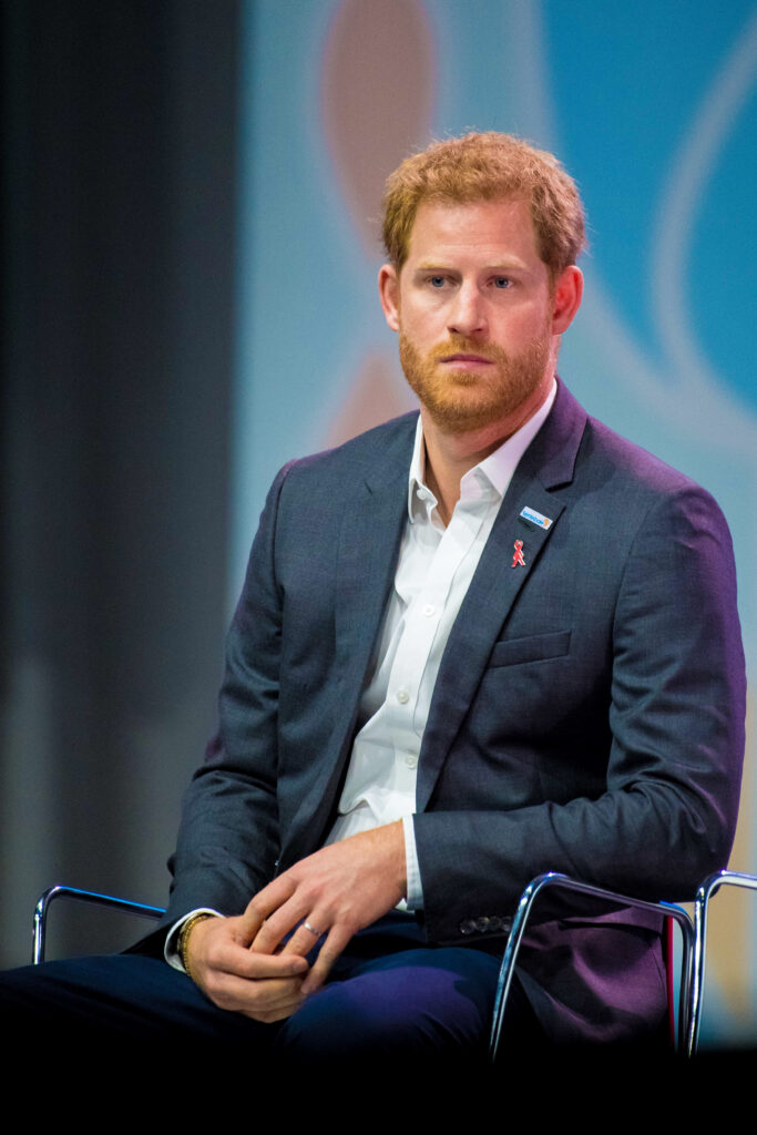 Prince Harry sitting down in suit 