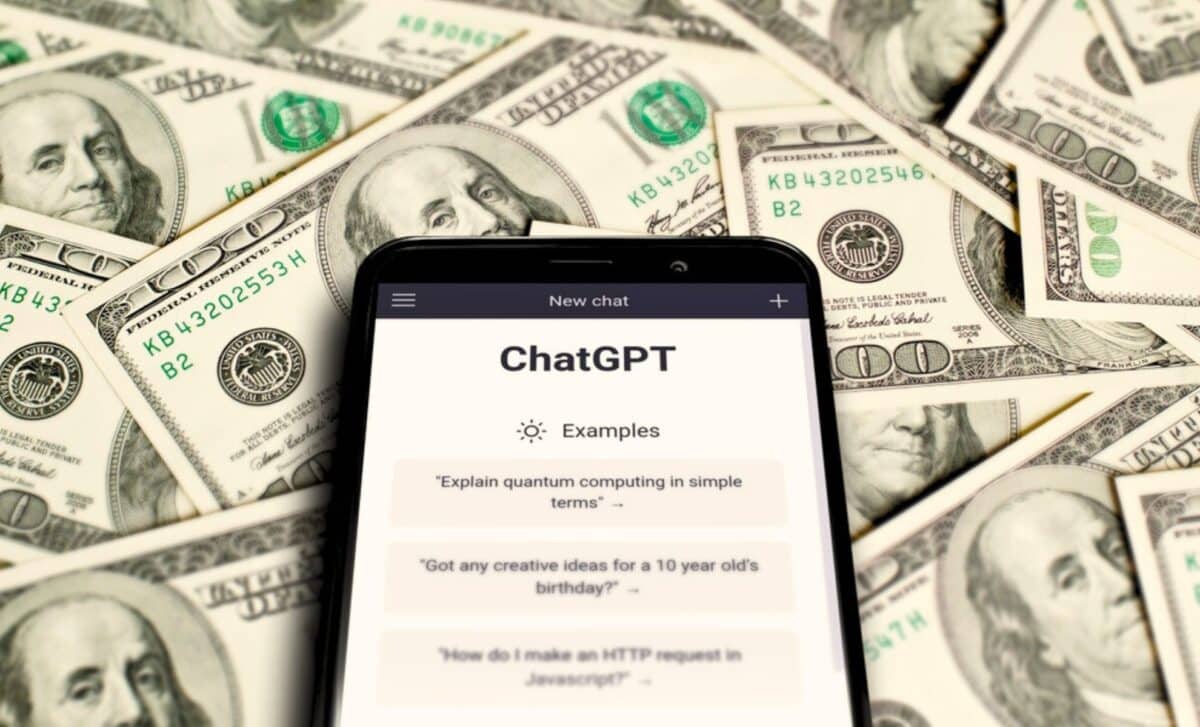 Chatgpt On A Smartphone Against A Backdrop Of Dollars