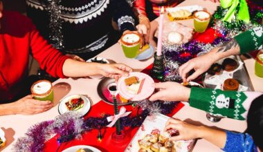 people clad in festive jumpers grabbing food of the table at Seven Dials Market